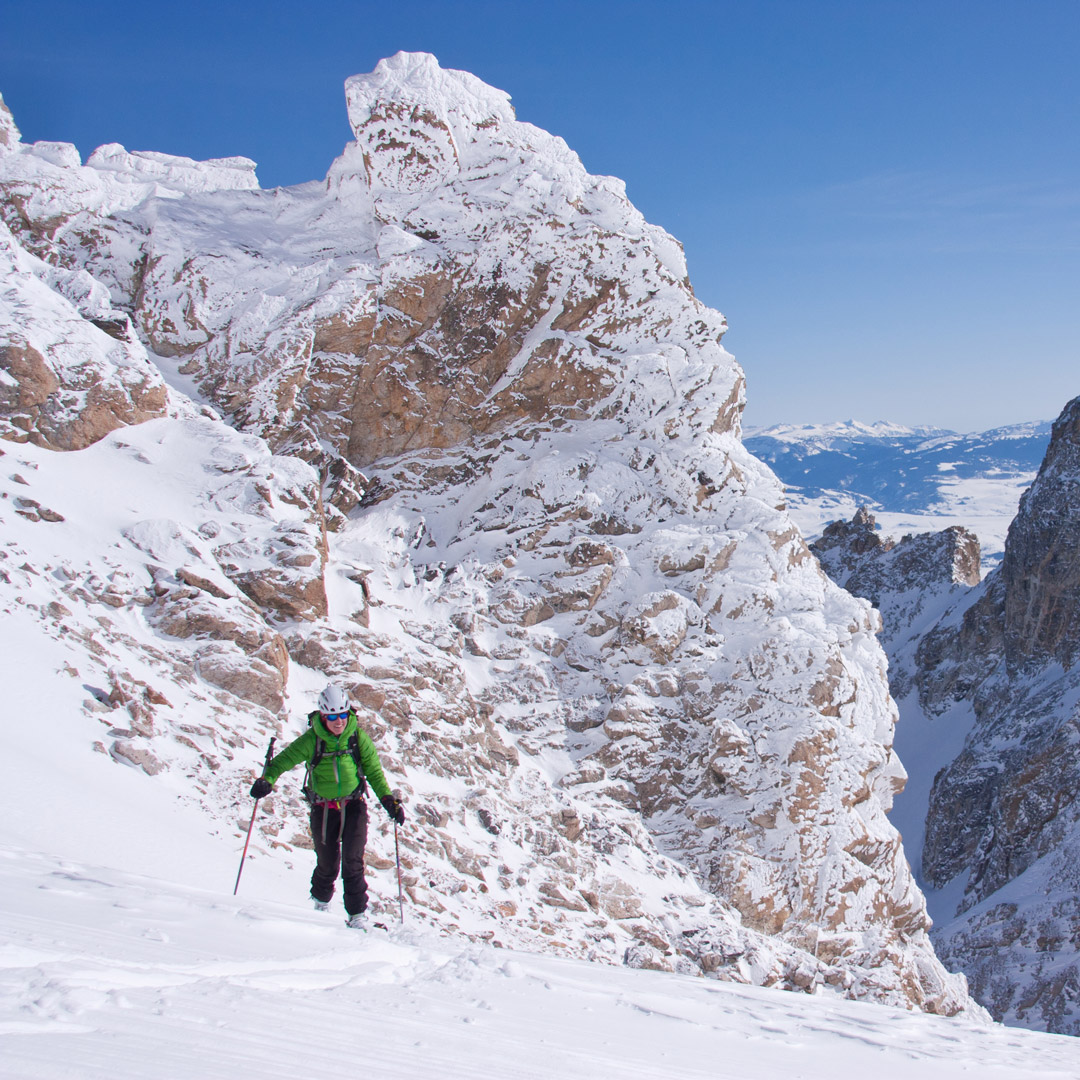 person dressed in green skiing in Jackson Wyoming