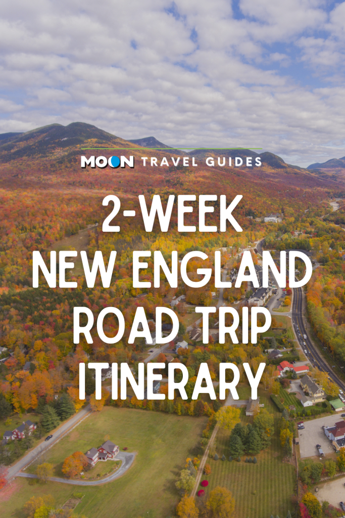 Aerial view of small town and fall forest with text 2-Week New England Road Trip Itinerary