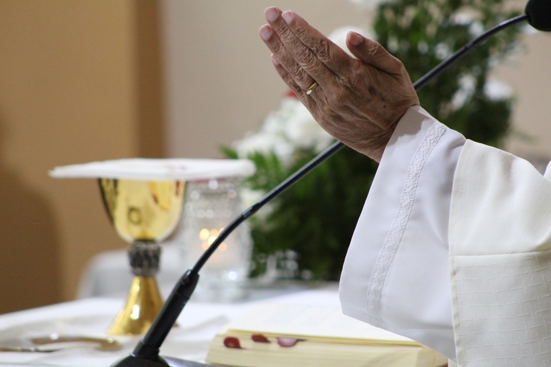 Priest's hands.