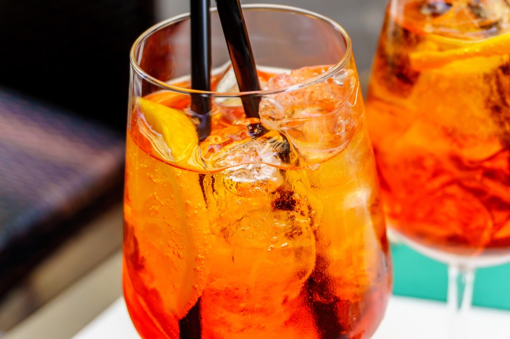 Close-up image of two glasses of aperol spritz